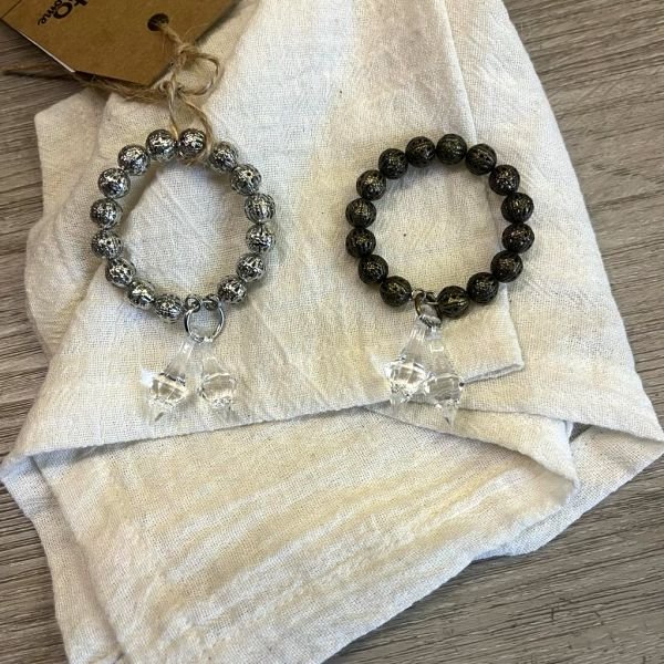 Servilletero filigranas con dije en color bronce o plateado