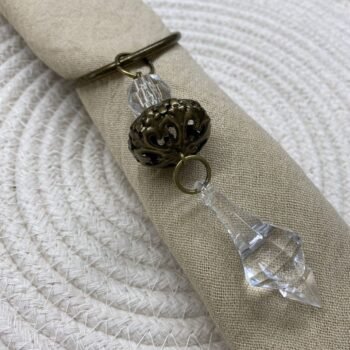 Servilletero cairel de bronce con dije colgante